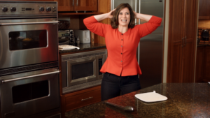 Sarah doing squats in kitchen (kitchen)